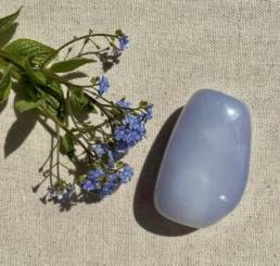 Photo of a gemstone with fresh flowers.